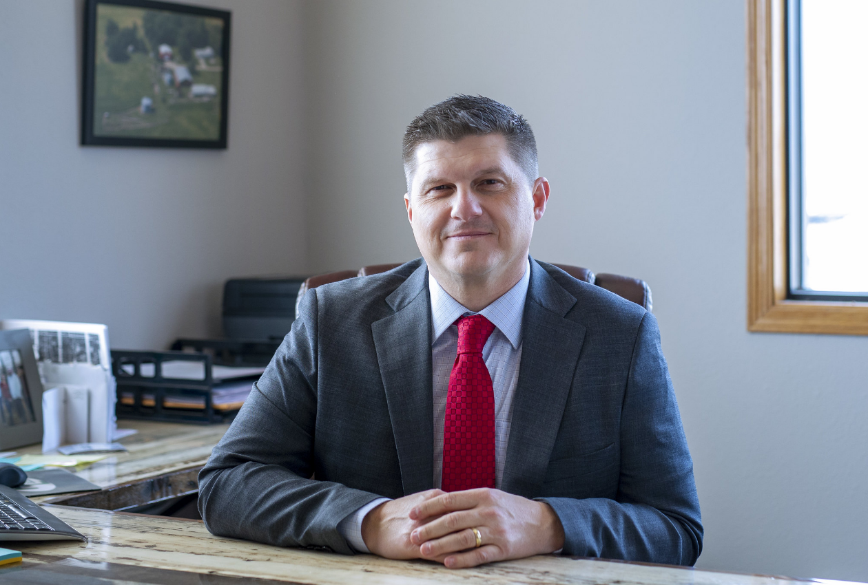 Finstad sitting at desk